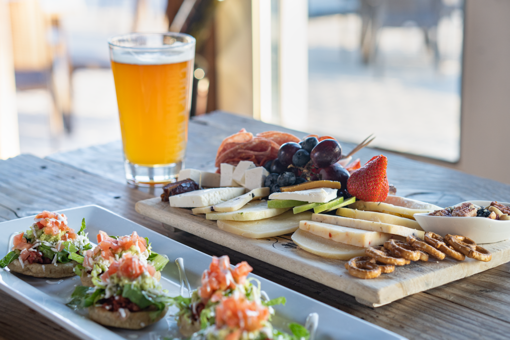 Charcuterie board, avocado toast, and beer from El Tapeo, Best Restaurants in Rocky Point, Live music and dancing in Puerto Penasco